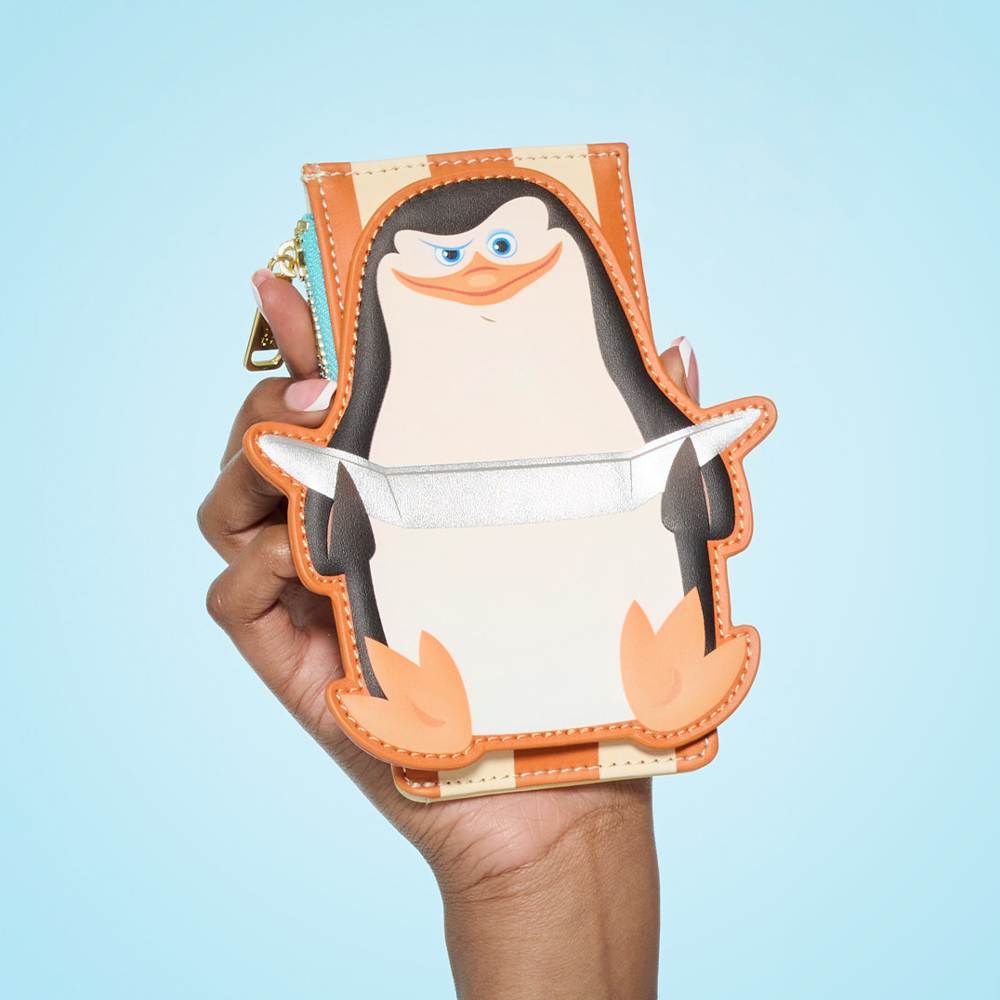 Close up of model holding Madagascar penguin Wallet