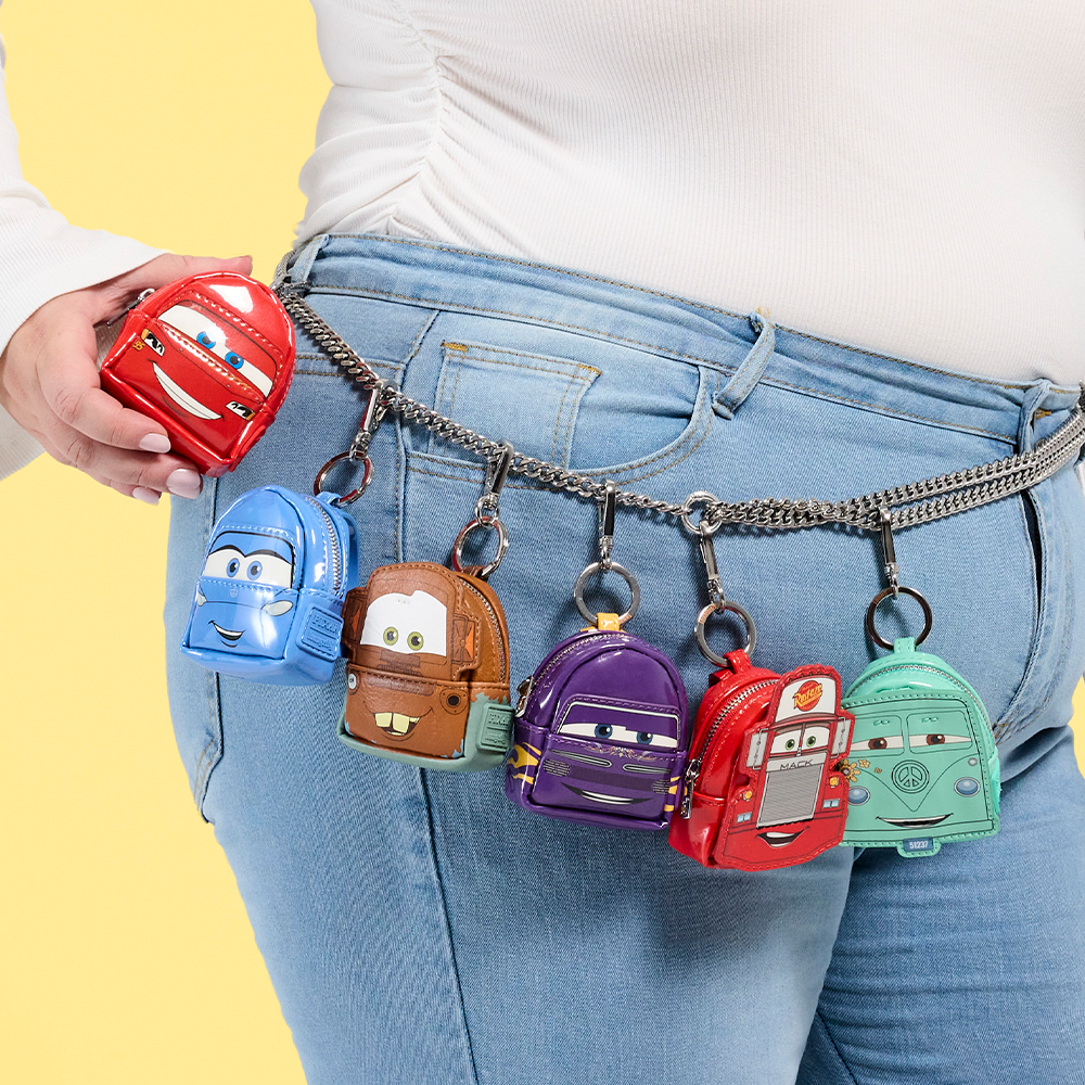 Close up of model wearing Loungefly Cars backpack charms on her waistband