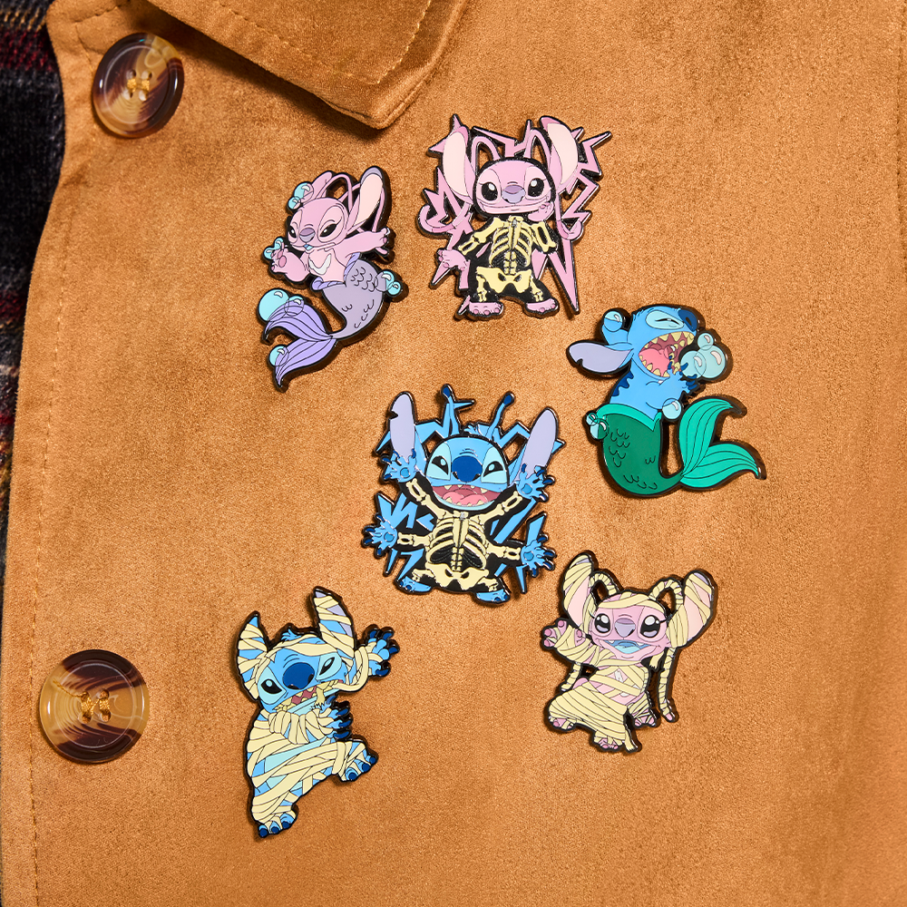 Lilo and Stitch pins on a brown, suede jacket lapel