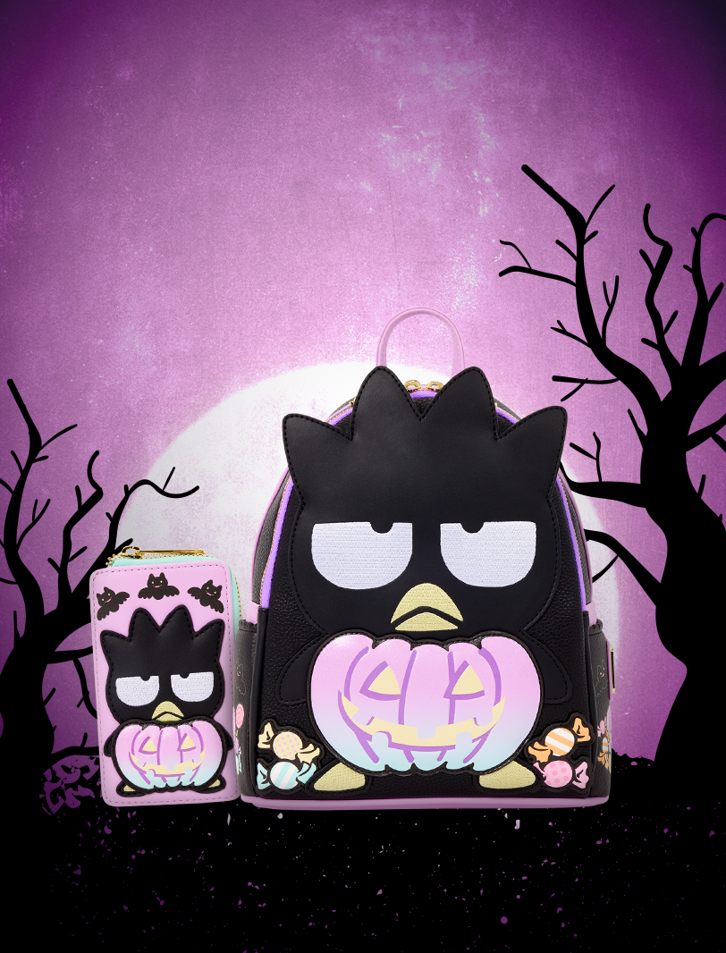 Badtz-Maru Loungefly Halloween backpack and wallet with glowing pumpkin designs against a spooky purple background.