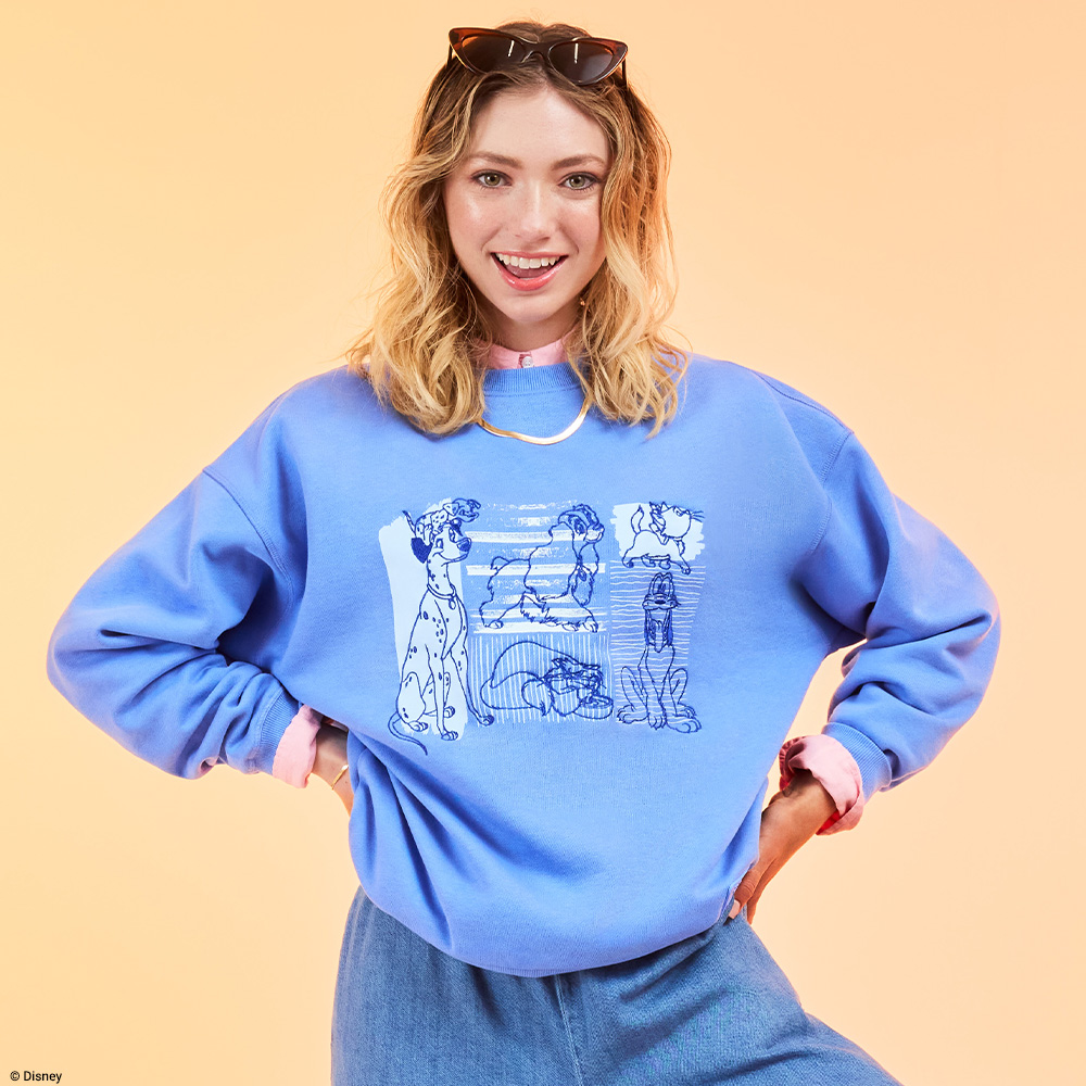 Orange background with model wearing Loungefly Disney Dogs Jumper