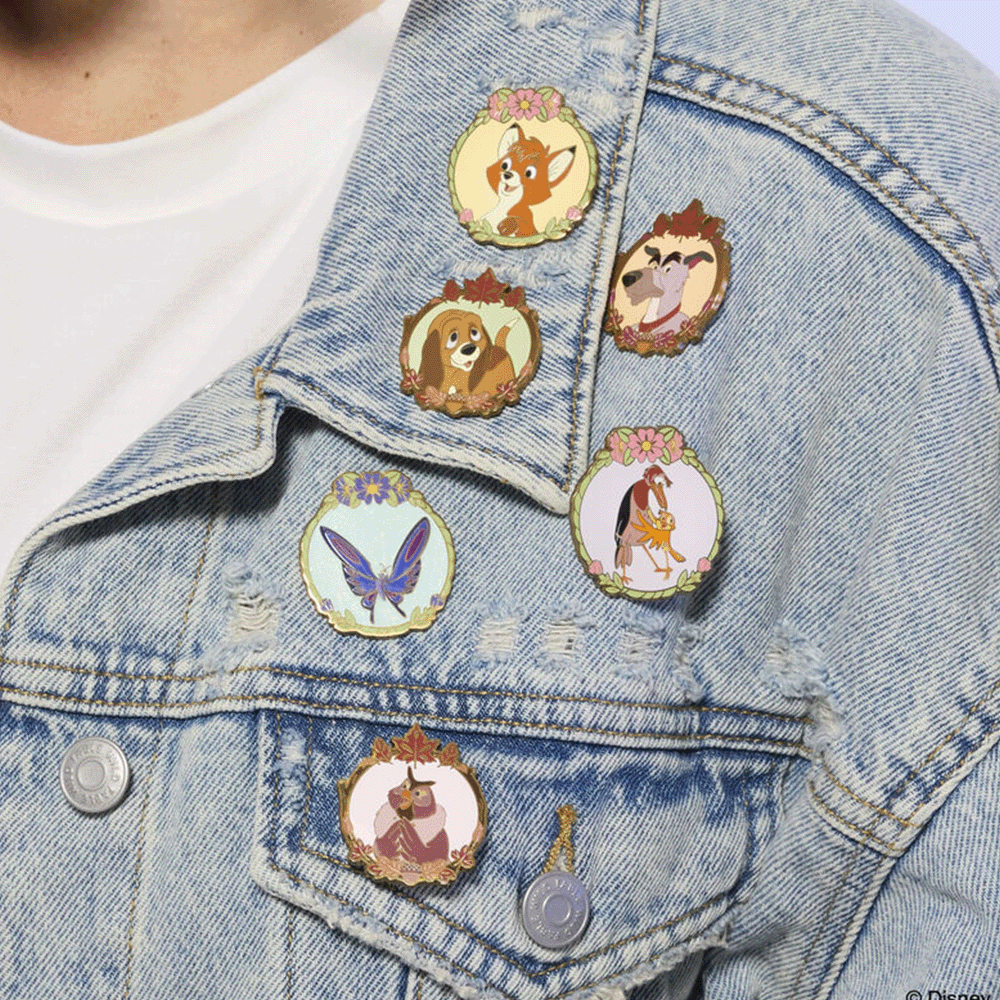 Disney the Fox and the Hound pins displayed on a denim jacket