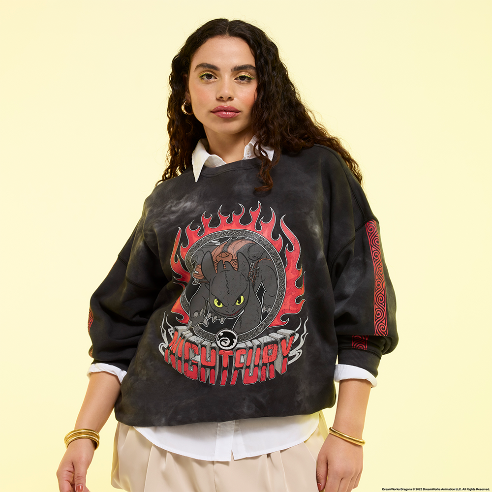 Yellow background with model wearing Loungefly How to Train Your Dragon apparel