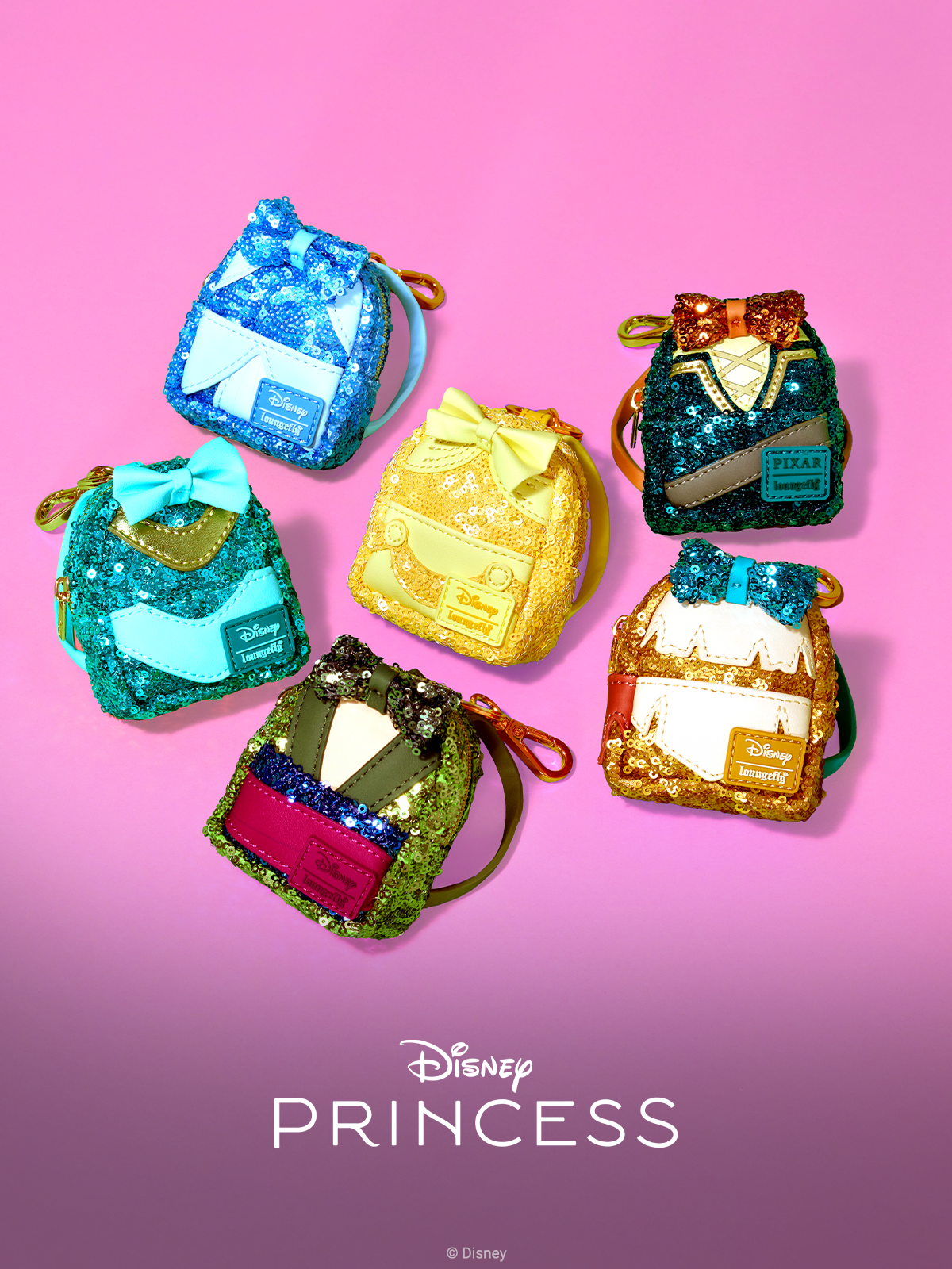 Pink background with close-up of Loungefly Disney Princess Sequin Series Mini Mystery Backpack Keychains