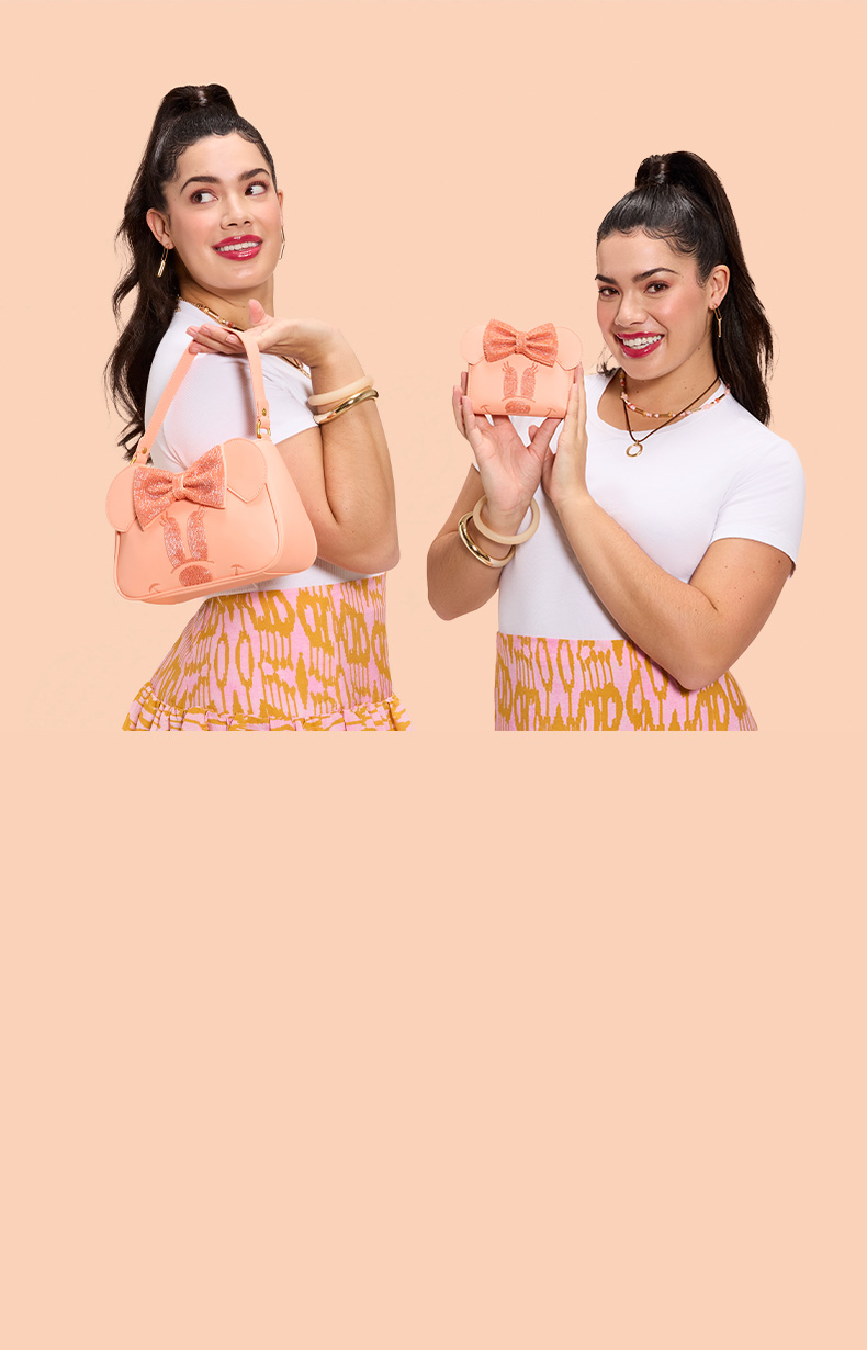 Light Orange background with model showcasing Loungefly Disney Minnie Mouse Coral exclusives