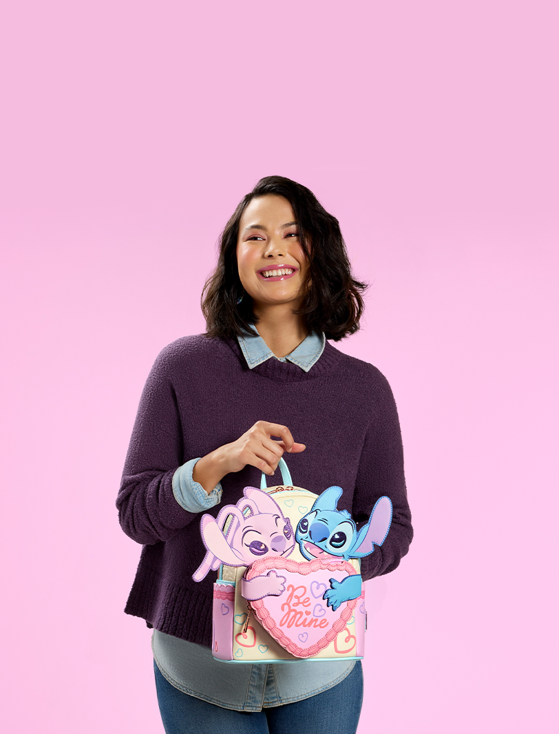 Hot Pink background with model showcasing Loungefly Disney Lilo & Stitch Valentine's Day collection