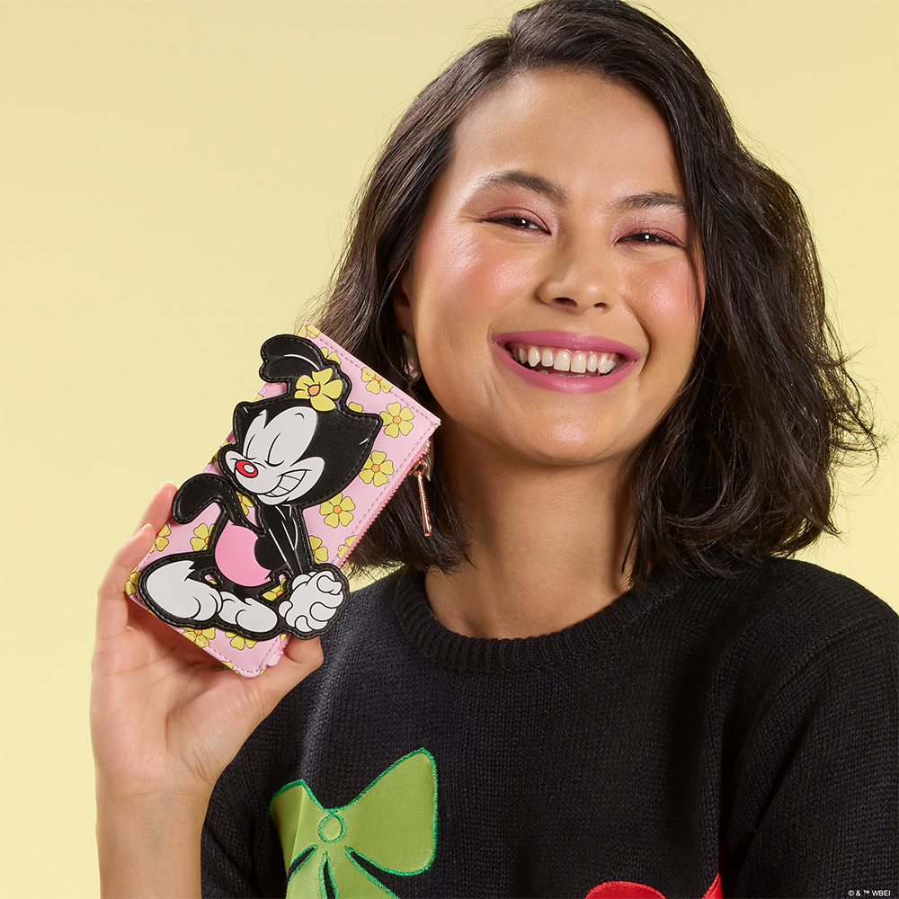 Olive Green background with model showcasing Loungefly Animaniacs Wallet