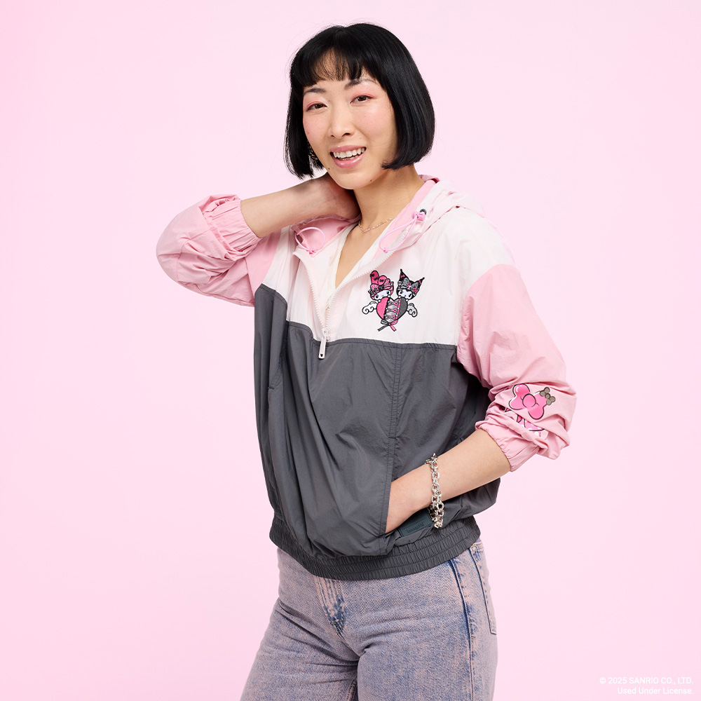 Pink background with model showcasing Loungefly Sanrio My Melody and Kuromi apparel