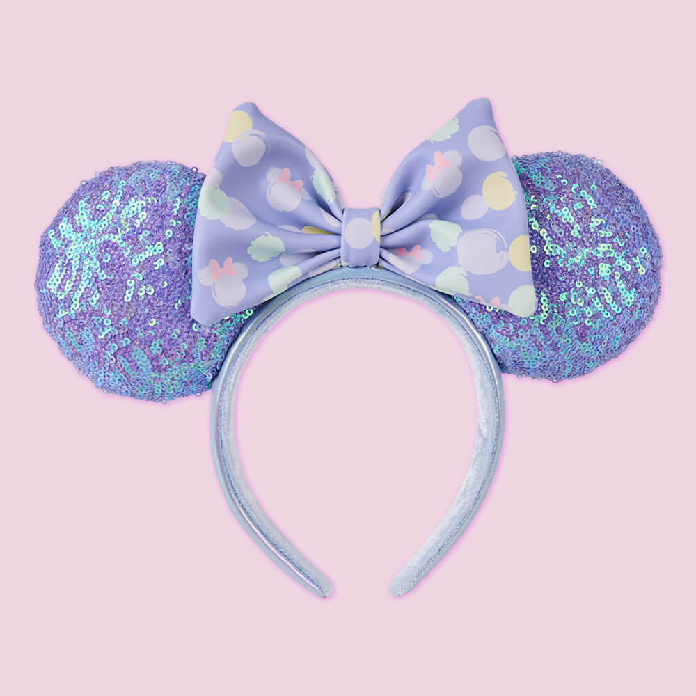 Pink background featuring Minnie Mouse Exclusive Iridescent All-Over Print Sequin Ear Headband