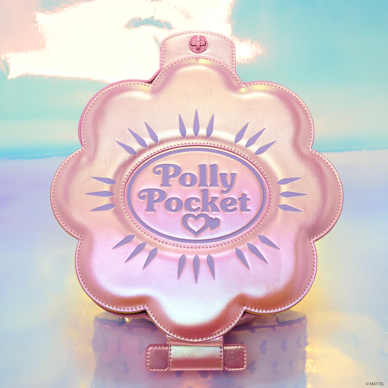 Pink iridescent Polly Pocket figural mini backpack against a shiny iridescent background 