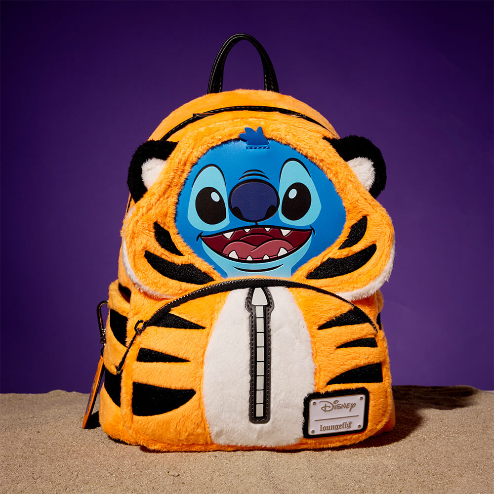 Purple background with sandy surface featuring Loungefly Exclusive Disney Stitch in Rajah Costume Mini Backpack