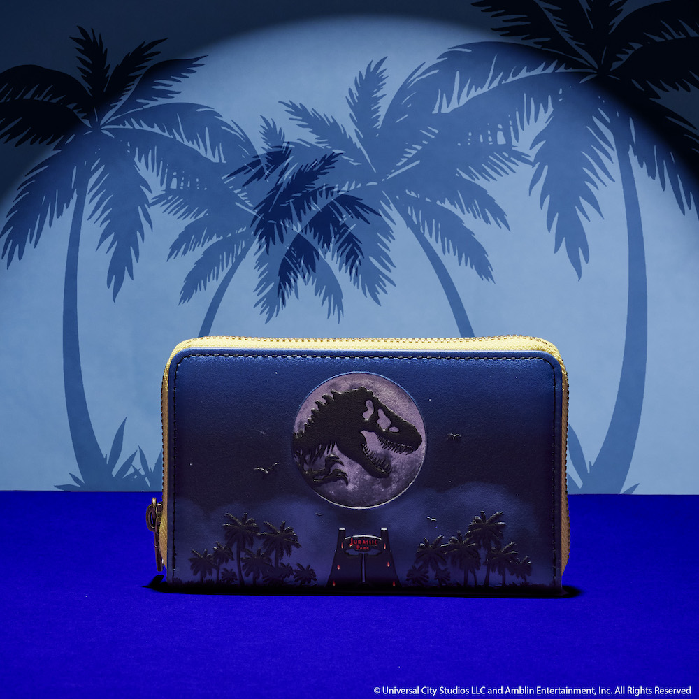 Blue wallet featuring the gates to Jurassic Park, above them is a moon with the shadow of a T-Rex