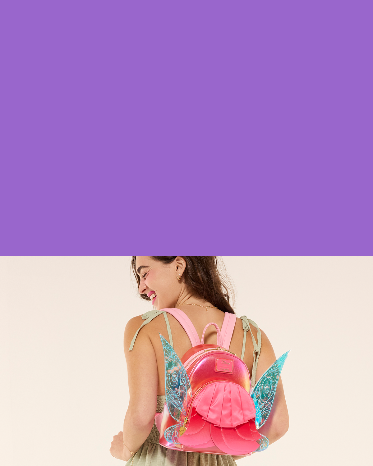 Purple background with image of model showcasing Loungefly Disney Fairies collection
