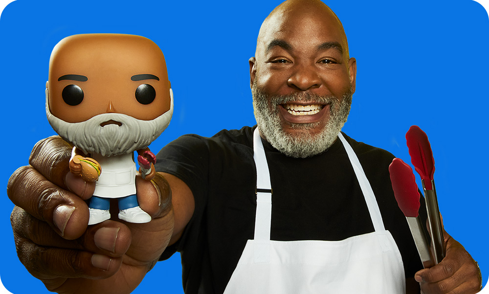 Blue background with Dad holding his custom Funko POP! Yourself vinyl figure with cooking accessories