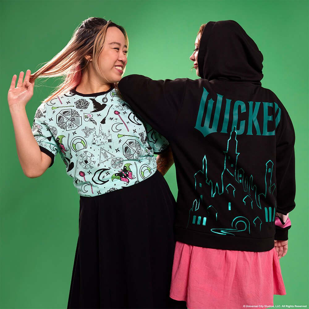 Green background with models wearing Loungefly November Wicked apparel