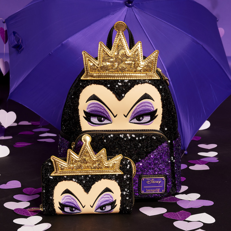 Sequin Loungefly mini backpack featuring the Evil Queen from Snow White and the matching zip around wallet sitting on a dark background in front of a purple umbrella and purple raining hearts.