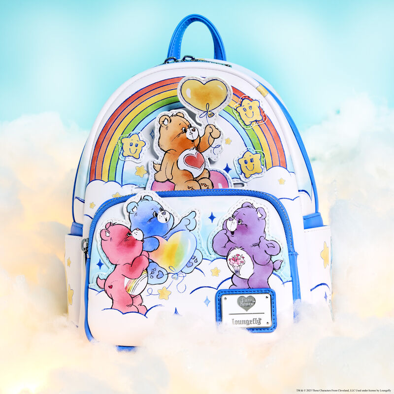 Loungefly Care Bears Care-A-Lot Rainbow Mini Backpack, featuring several Care Bears standing and sitting together on white clouds and surrounded by a rainbow, smiling stars, and sparkles. The bag sits on fluffy white clouds against a blue background.