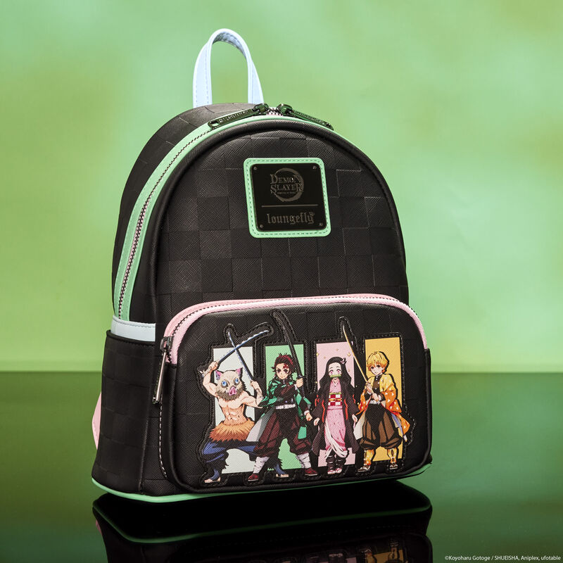 Loungefly Demon Slayer Heroes Group mini backpack sitting against a cloudy green background. The front pocket of the bag features Inosuke Hashibira, Tanjiro Kamado, Nezuko Kamado, and Zenitsu Agatsuma. 