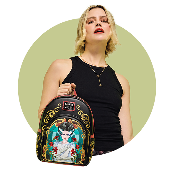Circle-cropped photo with Olive background and model showcasing Loungefly Universal Monsters Bride of Frankenstein Mini Backpack