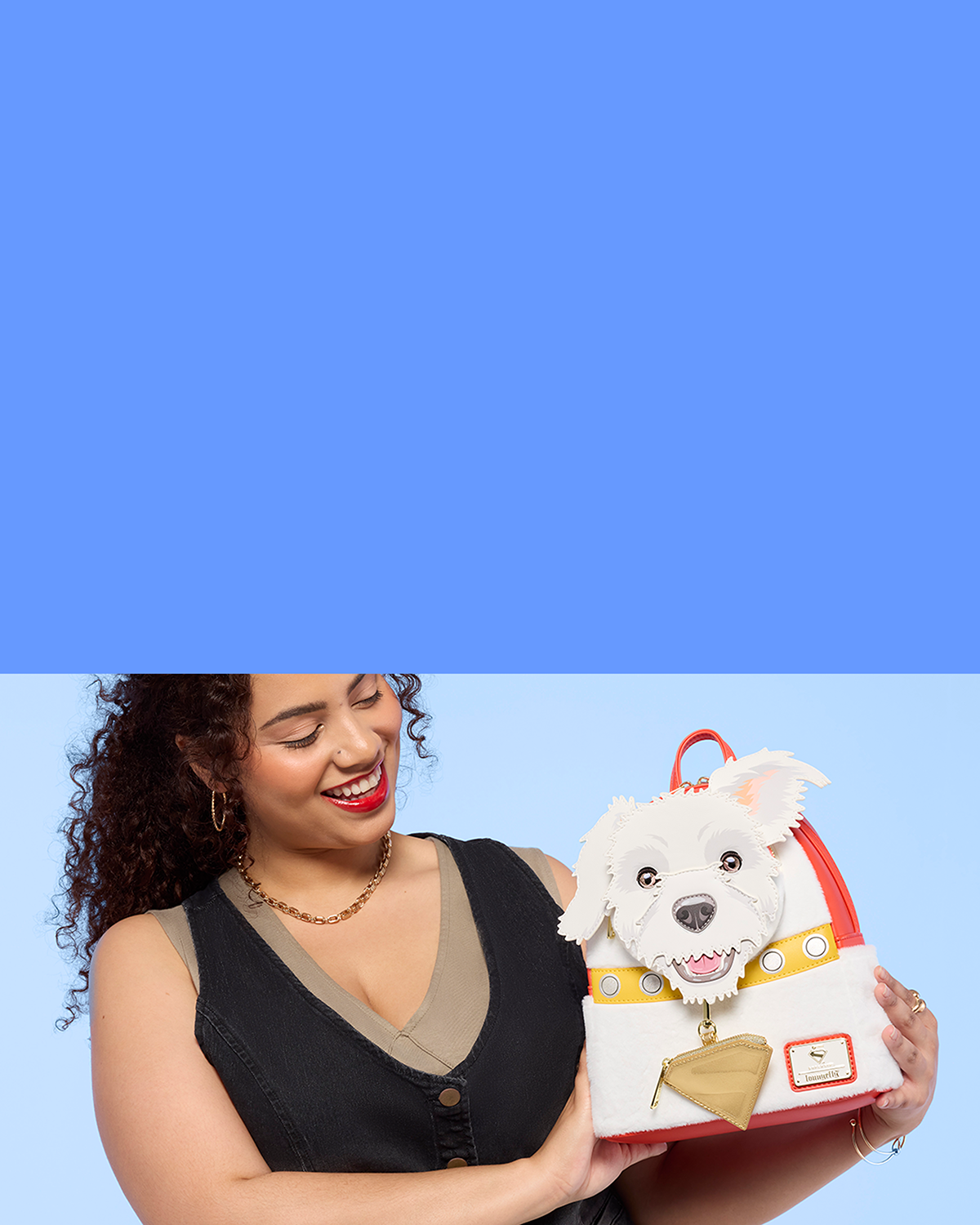 Blue background with model showcasing Loungefly DC Comics Supergirl style with solid Blue background on the right