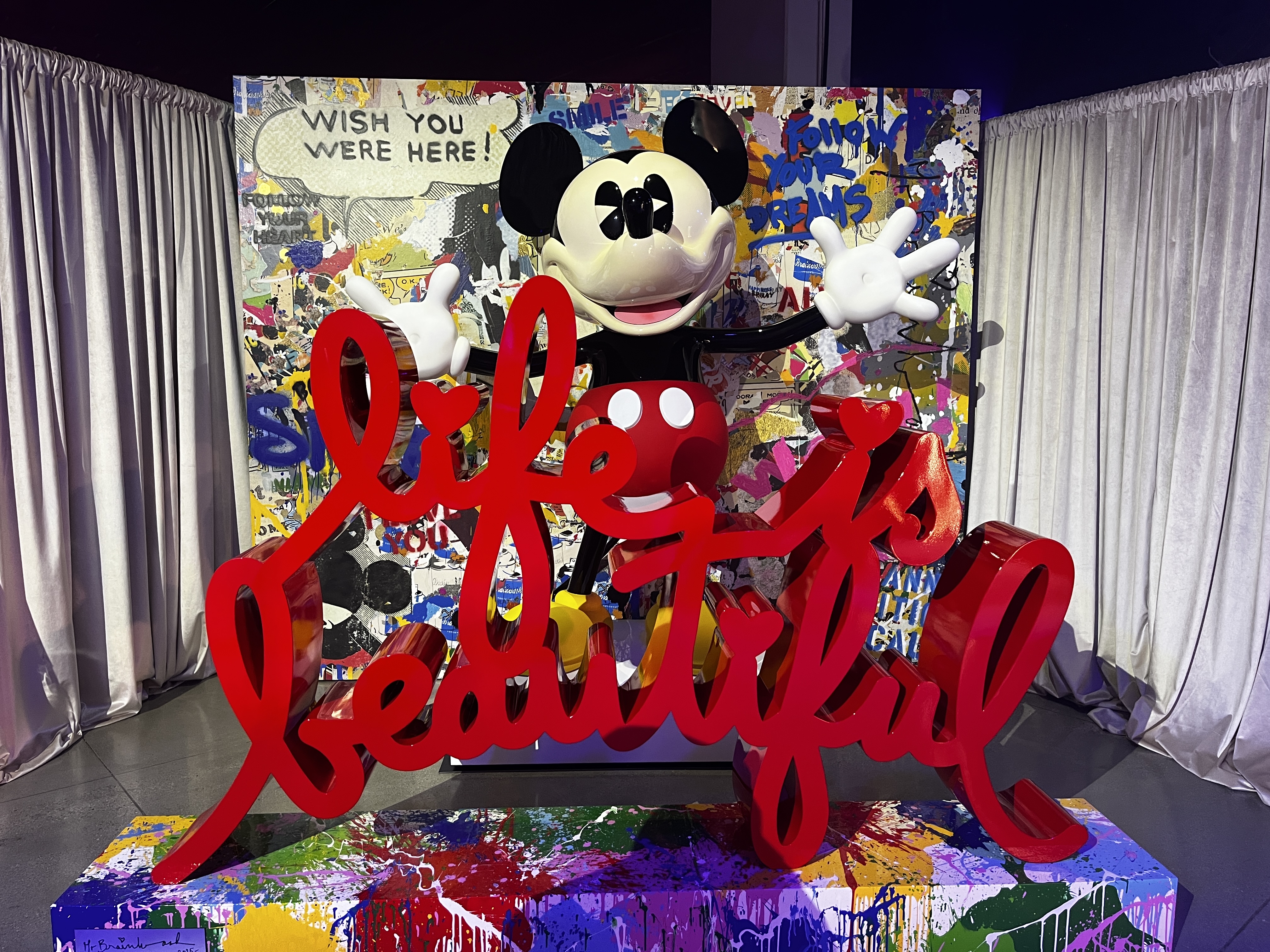 photo opp featuring a statue of Mickey with the words "Life is Beautiful" written in script.