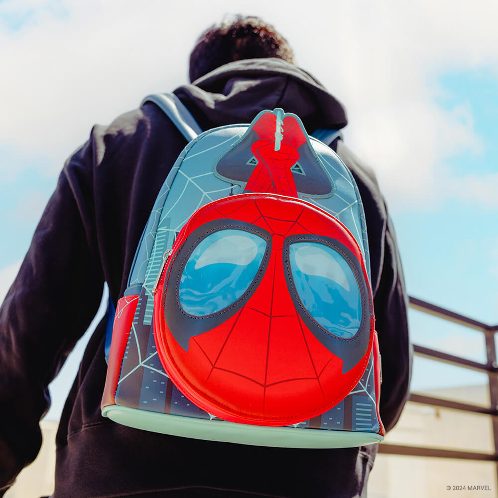 Blue sky with clouds background featuring model wearing San Diego Comic Con Marvel Spiderman Lenticular Mini Backpack