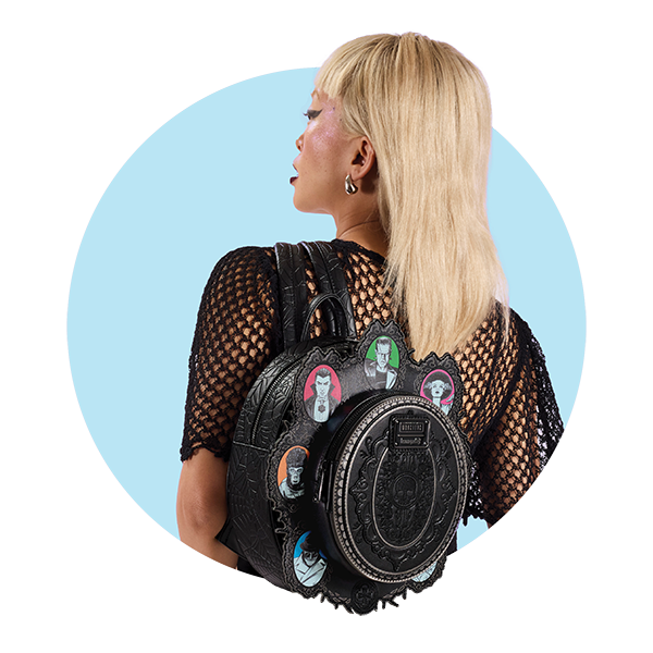 Circle-cropped photo with Blue background and model showcasing Loungefly Universal Monsters Cameos Mini Backpack