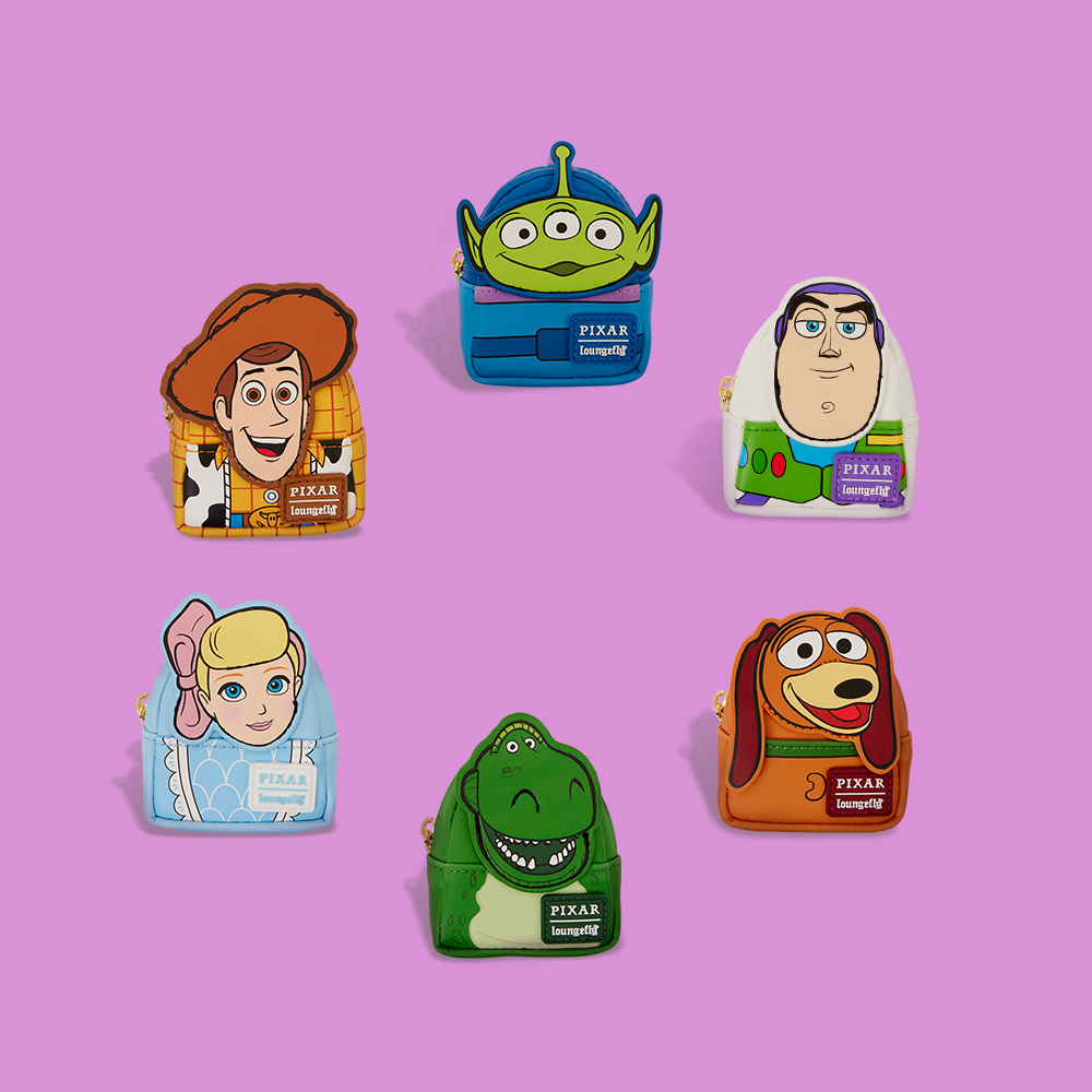 Pink background featuring Loungefly Disney Pixar Toy Story Mystery mini backpack charms