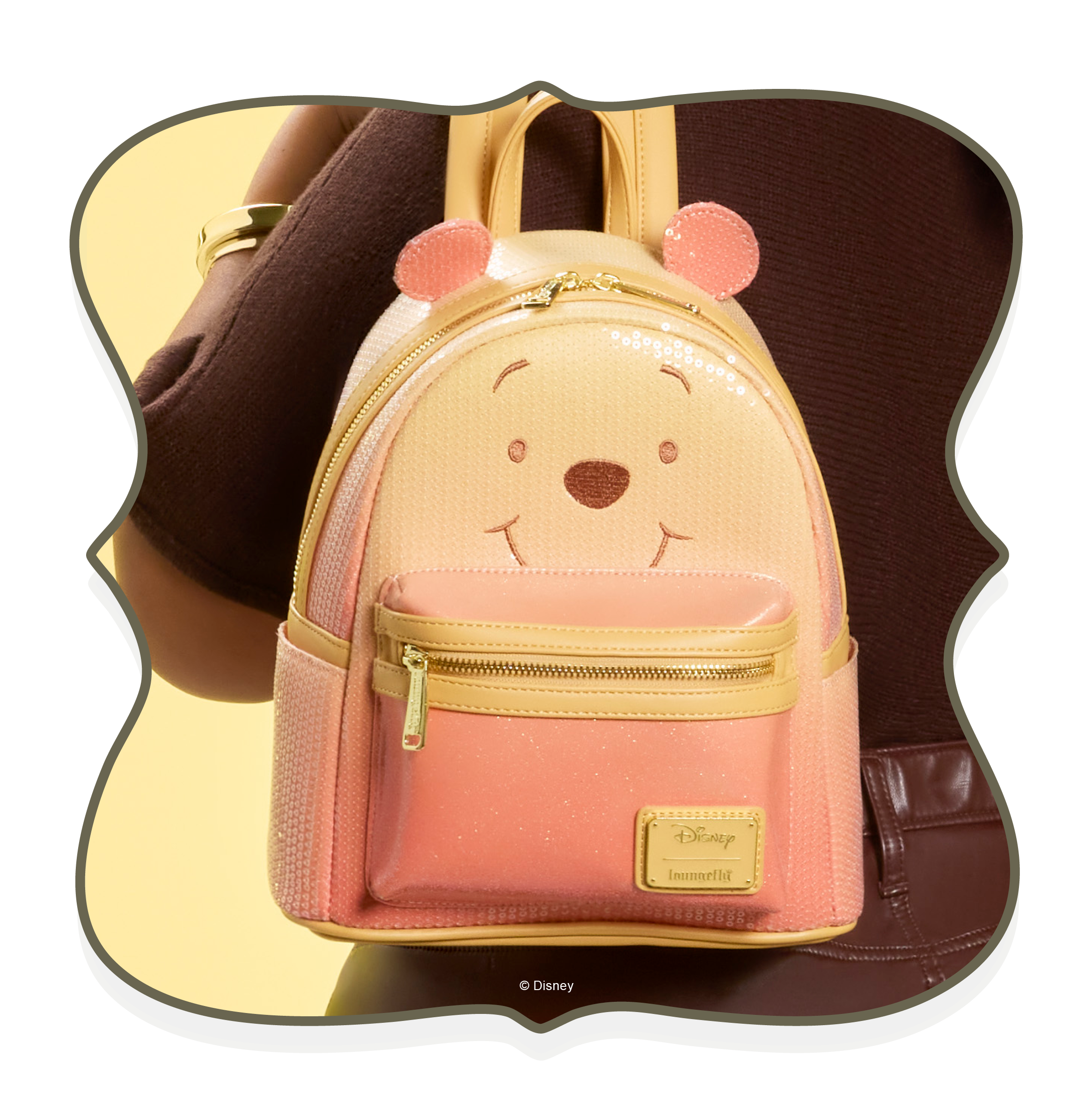 Green background with model showcasing Loungefly Wicked: For Good I Feel Wicked Crossbody Bag