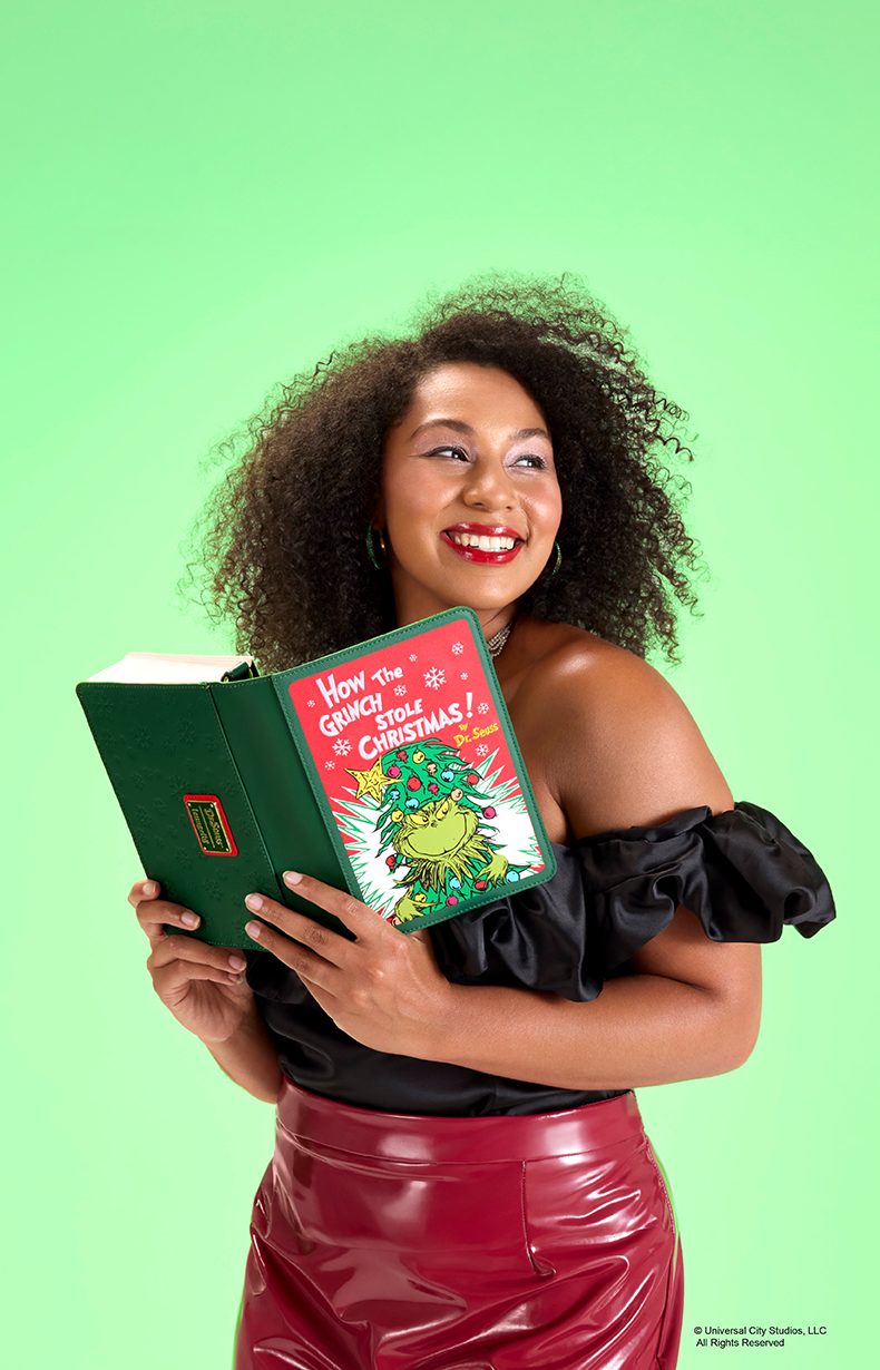 Green background with model showcasing Loungefly Dr. Seuss The Grinch Holiday collection