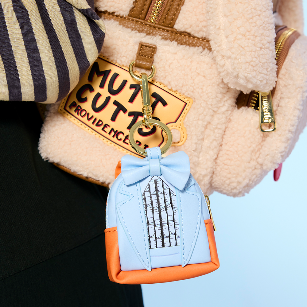 Close-up of model showcasing Loungefly Dumb & Dumber Mystery Bag Charms