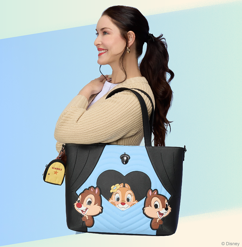 Blue pastel background with model showcasing Loungefly Disney Chip 'n Dale Tote