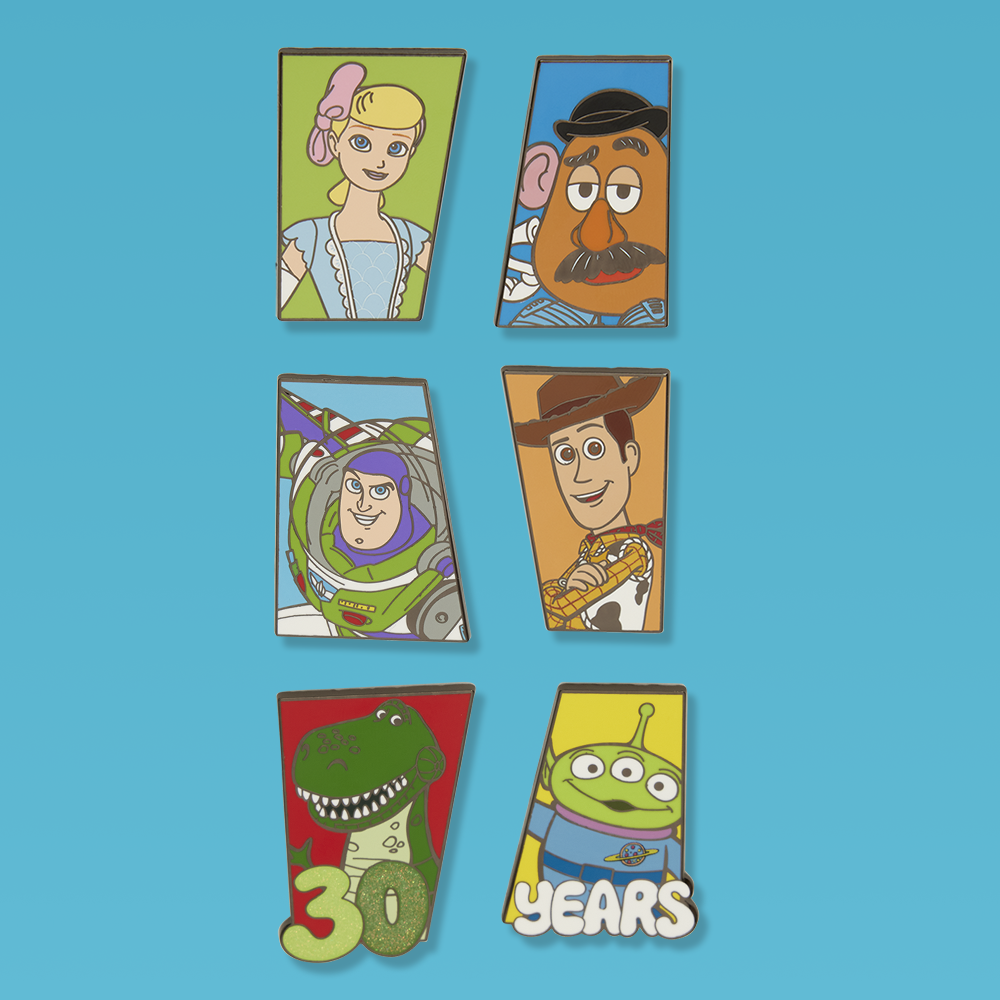 Teal background featuring Loungefly Disney Pixar Toy Story enamel pins
