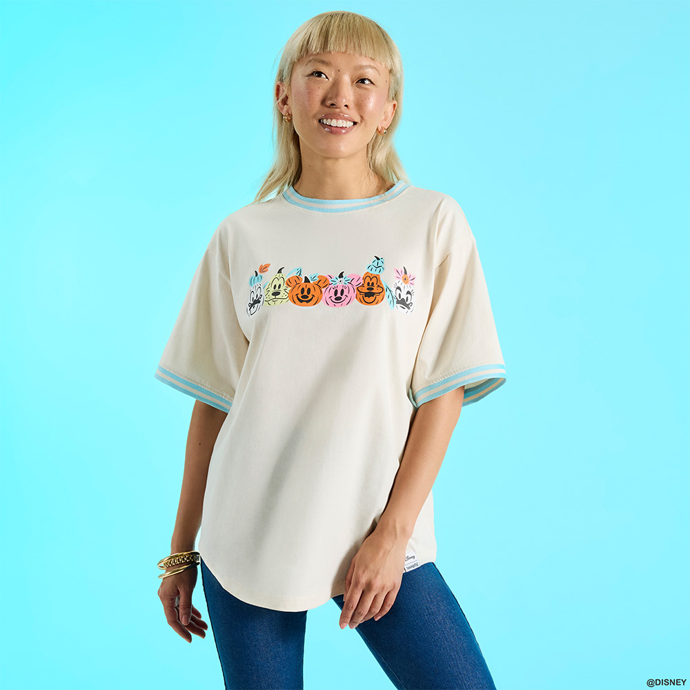 Blue background with model wearing Loungefly August Disney Mickey and Friends apparel