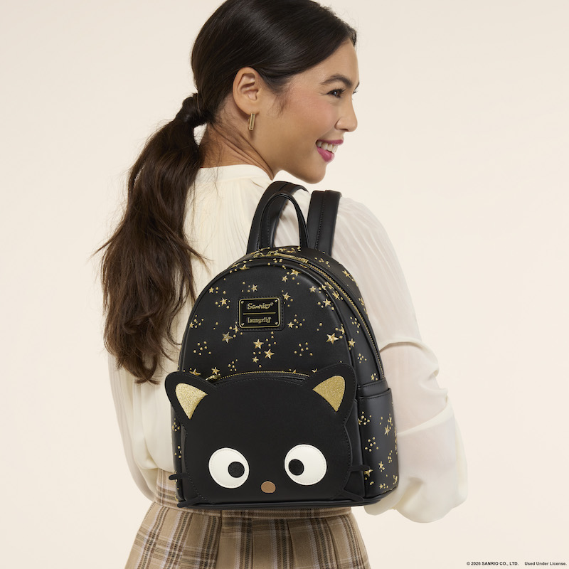 woman facing away from camera wearing the Loungefly Chococat Stars Mini Backpack