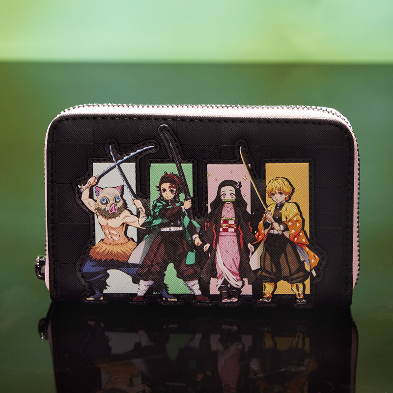 Loungefly Demon Slayer Heroes Group zip around wallet sitting against a cloudy green background. The front of the wallet features Inosuke Hashibira, Tanjiro Kamado, Nezuko Kamado, and Zenitsu Agatsuma. 