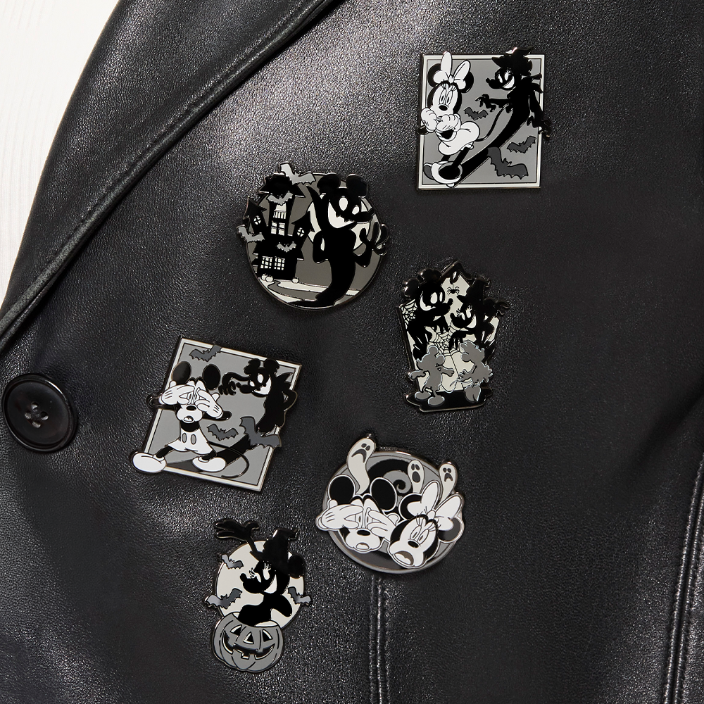 Close-up of Black sweater featuring Loungefly Disney Mickey and Minnie Halloween pins