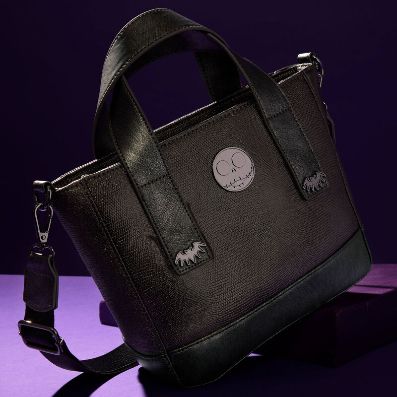 Loungefly Nightmare Before Christmas mini textured tote bag sitting on an angle against a dark purple background.