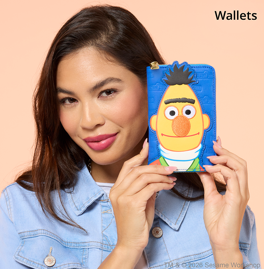 Orange background with model holding Loungefly Sesame Street Wallet
