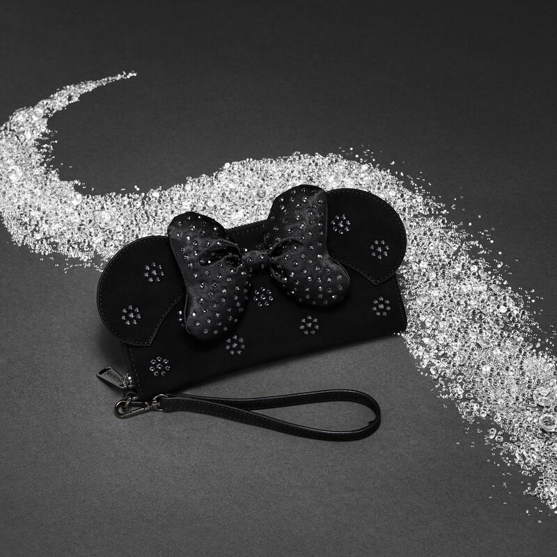 Gray/black background with a trail of crystals flanking the Loungefly Disney Minnie Mouse with Swarovski Crystals wristlet wallet