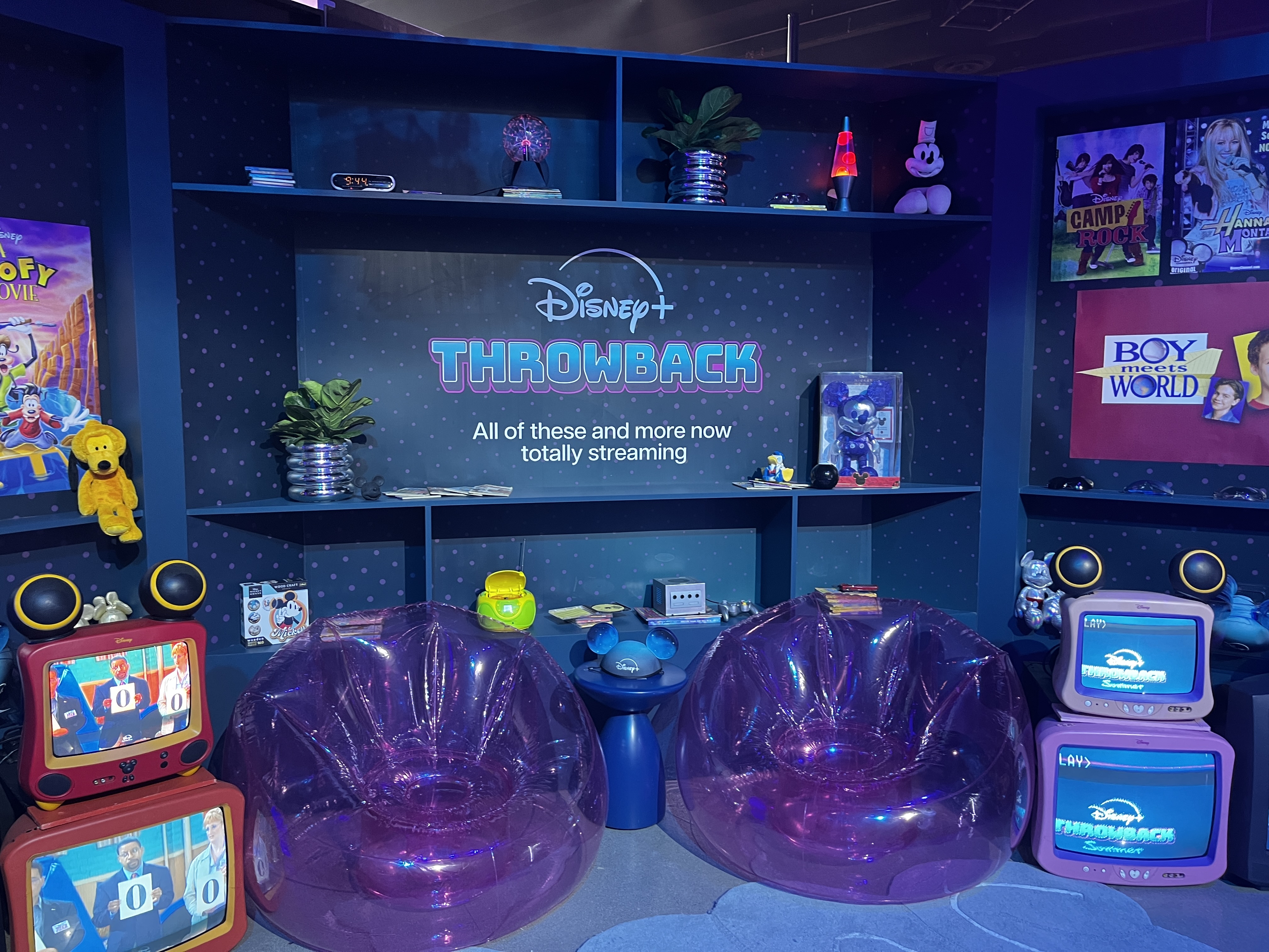 Disney+ throwback photo app featuring old school technology, blow up chairs, and nostalgic Disney movies and shows.