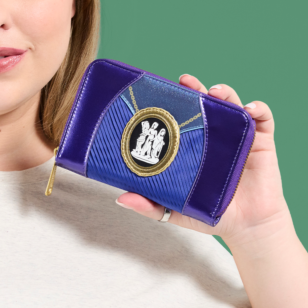 Close-up of model in front of Green background holding Loungefly Marvel Agatha Cosplay zip-around wallet