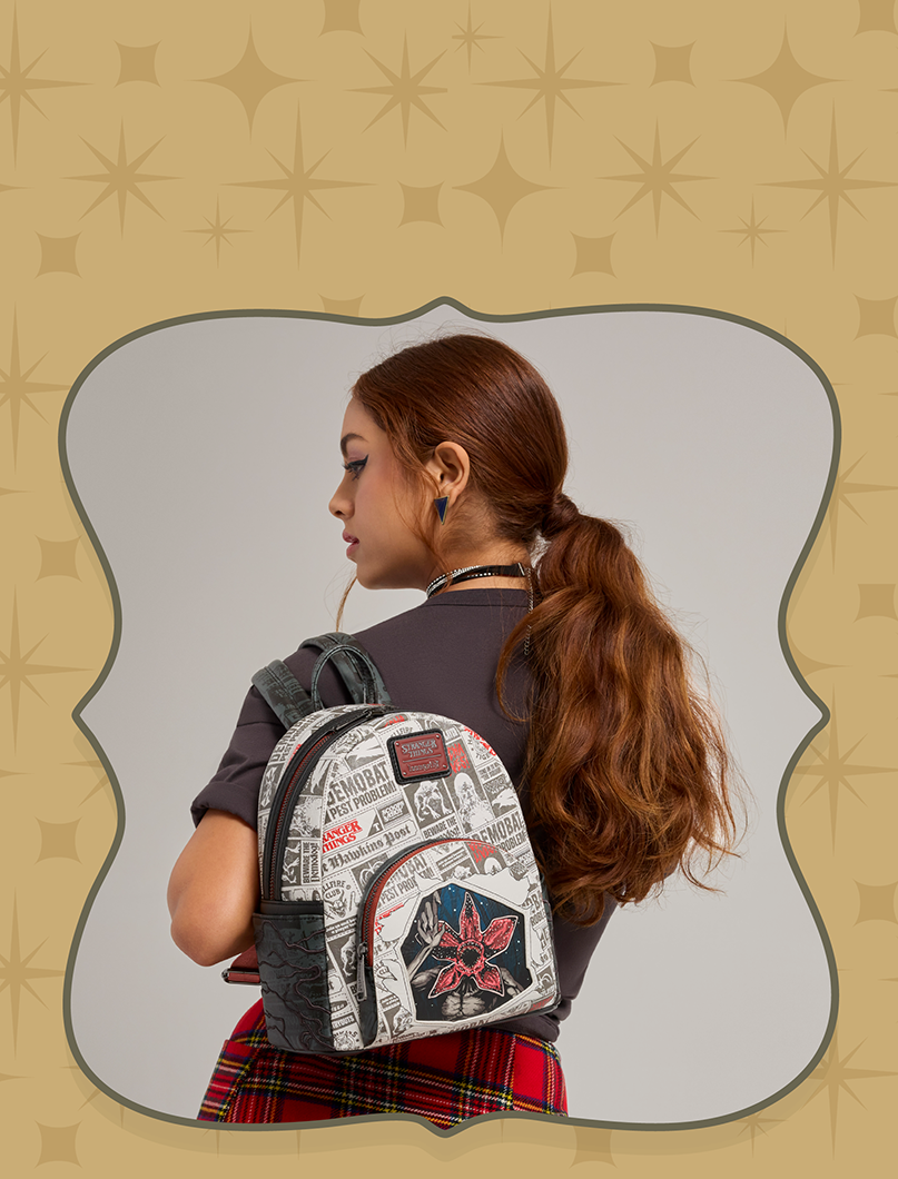 Gray background with model showcasing Loungefly Rocky Horror Picture Show collection