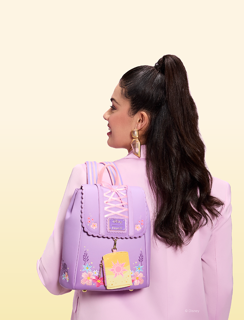 Yellow background with model and Loungefly Tangled exclusive