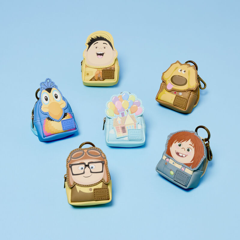 The Loungefly Pixar Up mystery mini backpack keychain charms featuring Young Carl, Young Ellie, Kevin, Russell, Dug, and Carl&rsquo;s House sitting against a light blue background. 