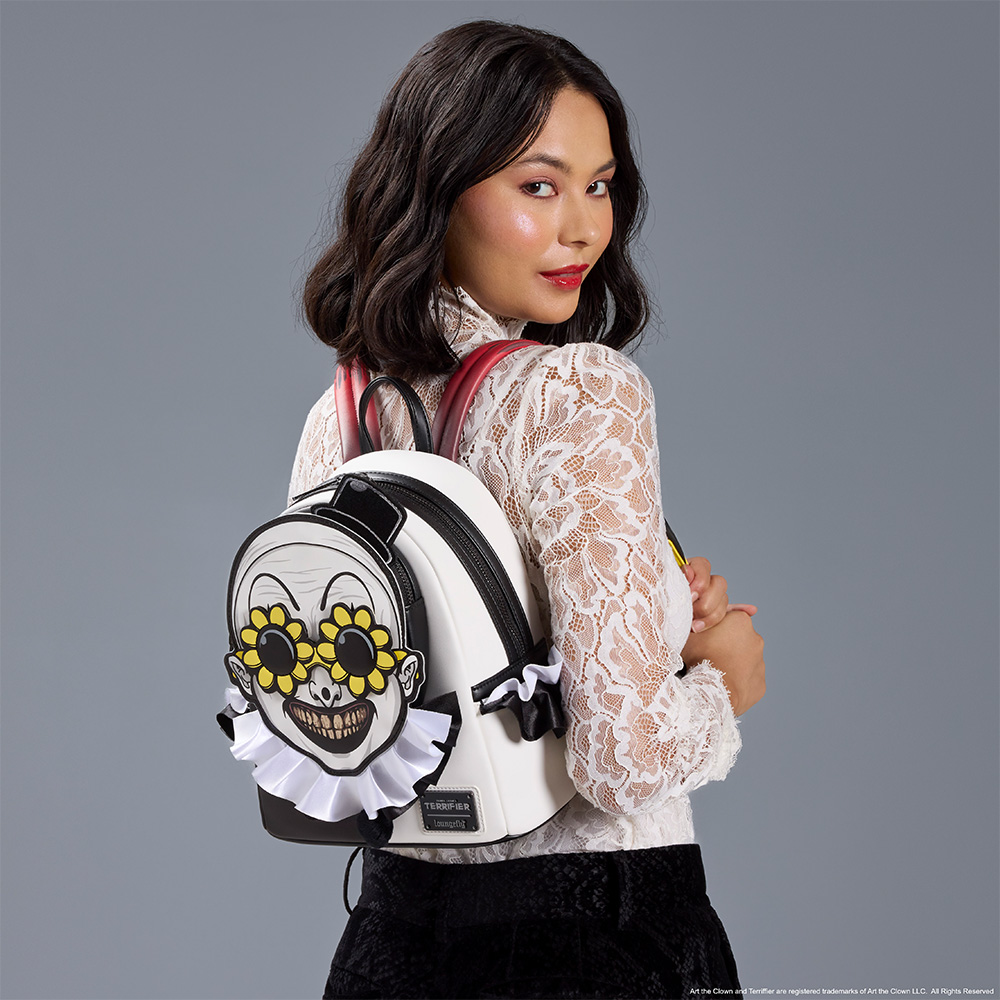 Gray background with model showcasing Loungefly Terrifier Mini Backpack