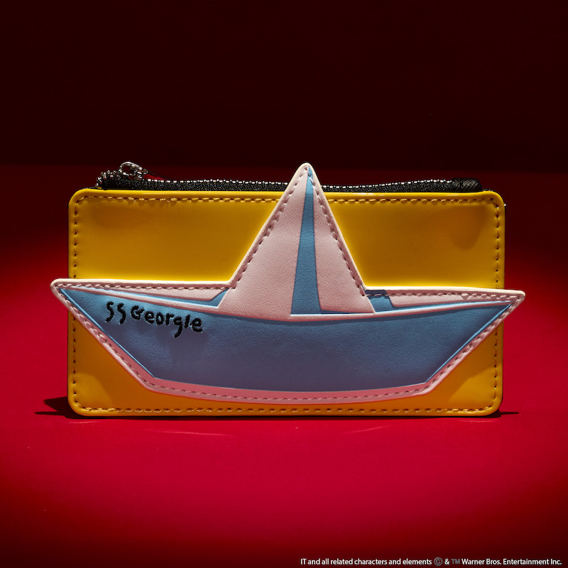 Loungefly card holder featuring an appliqué of Georgie's boat. It sits against a dark red and black background.