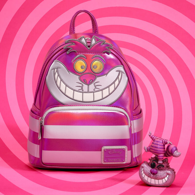 Image of the pink and silver metallic Cheshire Cat mini backpack and diamond Funko Pop! against a swirling two-tone pink background