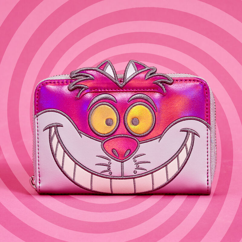 Image of the platinum Cheshire Cat wallet against a two-tone pink swirling background