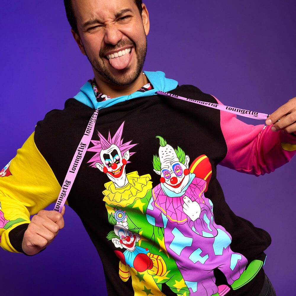 Purple background with model wearing September Killer Klowns from Outer Space Unisex Hoodie